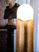 Detail of the spherical diffuser at the top of the floor lamp