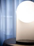 Detail of the sphere diffuser and black Marquina marble base