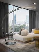 Curved 'arched' development of the lamp, shown here in a living room in combination with coffee tables from the same collection