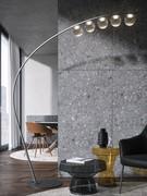 The matt black lacquered metal frame supports 5 bubble-shaped lights in transparent smoked glass