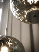 Detail of the chromed end disc and texture of the Venetian smoked glass with its eye-catching reflections