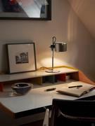 Coupé lamp by Oluce in the 'Mini' table version, here proposed in anodic bronze finish 