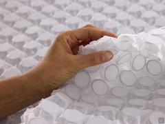Detail of the intermediate layer made up of mini-microspheres with a diameter and height of 2 cm that distribute the weight evenly and provide punctual support