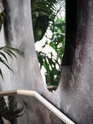Akumal mirror by Cattelan, detail of the mirror surface spaced from the wall (to position the transparent smoked glass pane behind)