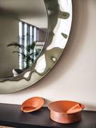 Detail of the bush-hammered frame matching the central mirror on Cattelan's Cosmos mirror
