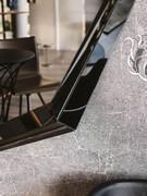 Detail of mirrored polygonal frame in smoked finish