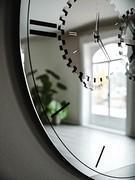 Detail of the Times mirror, with gear-shaped mirror decoration