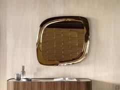 Platinum framed wall mirror in the bronze version above the Lena sideboard