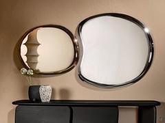 Liquid mirrors with mirrored frames with distinctive soft shapes, perfect for creating compositions over sideboards