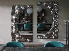 Composition consisting of two wall-mounted Fluid mirrors placed in a living context