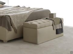 Edison is a rectangular storage pouffe with tufted seat