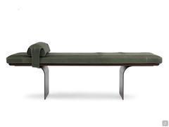 Detail of the Selma bench cushion resting on a wooden base and curved metal legs