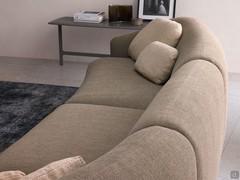 Detail of the curved, upholstered backrests of the Laurent outlet sofa