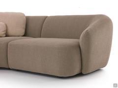 Detail of the curved backrest that acts as an armrest and contains the shaped seat