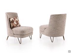 Beatrix outlet armchair with metal hairpin feet covered in Chanel fabric with matching patterned cushion
