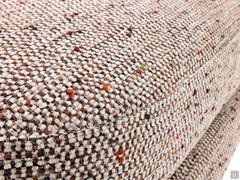 Detail of upholstered seat cushion covered in fabric