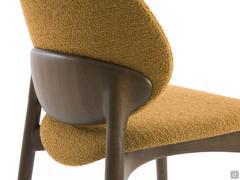 Detail of the wooden counter-backrest perfectly joined to the rear legs