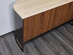 Structure, fronts and top come together in a prestigious material mix of metal, wood and marble