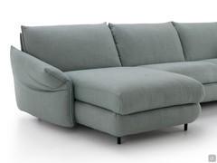 Detail of upholstered chaise longue with high wooden feet