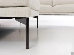 Detail of thin tubular high feet in black nickel metal