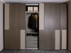 The central door slides to the right and shows the interior equipment: drawer unit with four drawers and shelf with hanging tube.