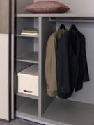 Detail of the equipment of the lower part of the side compartment: partition with hanging tube and side shelves