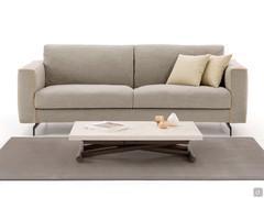 Bento outlet coffee table, adjustable in height, positioned opposite the sofa