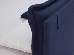 Detail of the headboard with attached cushions