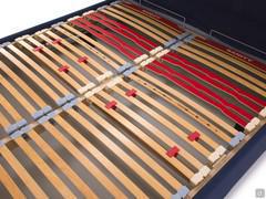Detail of the Wood Relax orthopaedic bed base with wooden frame and cushioned slats for optimal comfort