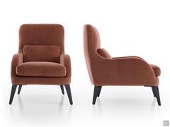 Front and side view of the Mabel outlet armchair from which the curvaceous contoured armrests can be appreciated
