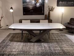 Stratos outlet table with crossed structure and rounded lower profile