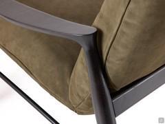 Detail of the moka-stained oak frame supporting the upholstered shell