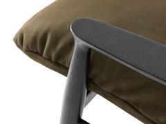 Detail of the workmanship of the wooden armrest perfectly matched to the tapered leg