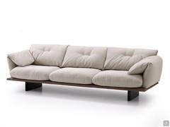 Two-tone Norman outlet linear sofa with precious contrasting embroidery, resting on high wooden feet