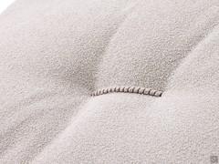 Detail of the back cushion with decorative embroidery detail with contrasting stitching threads. The embroidery gives a 'dynamic' effect to the cushion, recreating folds on the surface 