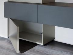 Each column ends with a small hinged compartment resting on the floor, providing extra storage space even under wall-hung base units