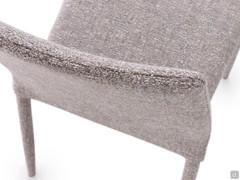 Detail of the high upholstered back of the Akira 2.0 outlet chair
