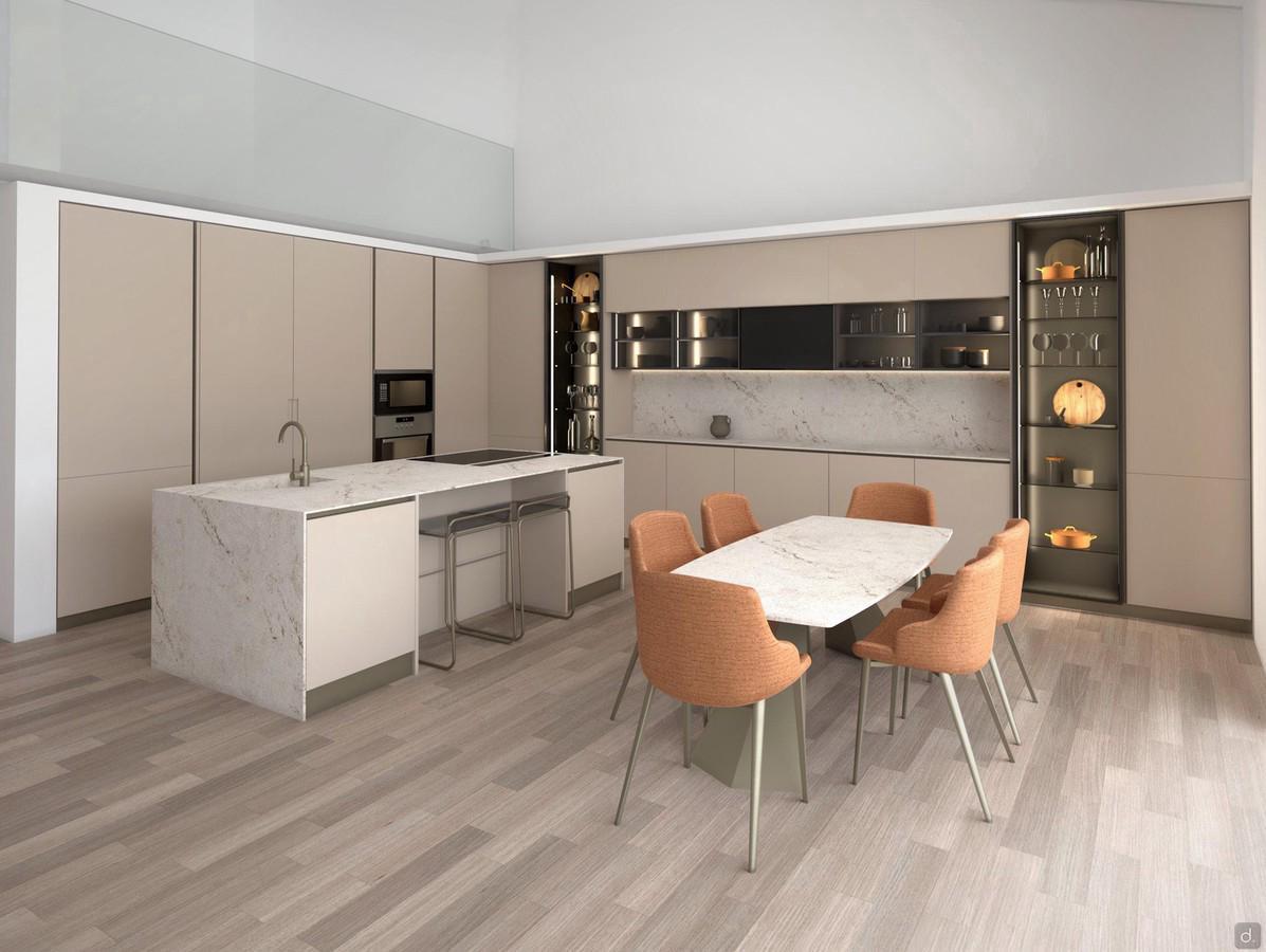 Large corner kitchen composition with working island. Area complete with table and chairs.