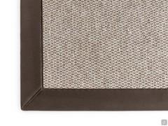 Detail of the rug in melange brown and of the edge in moor nubuck eco-leather