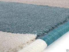Detail of the serged edging with thread matching the different colour patches