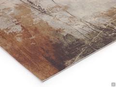 Detail of the short pile viscose carpet with abstract pattern in sand, brick orange and dove brown tones