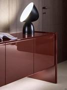 Glossy lacquer hinged doors in the Amarone finish with visible bevelling on top, a characteristic feature of the Manila sideboard model