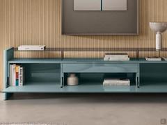 Interior of the Manila sideboard in the version with smoked glass top. Always included is an internal drawer with a matt lacquered front to match the structure