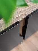 Detail of sepia-black lacquered doors and marble top