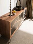 Three-quarter view from above, showing the contrasting combination of Walnut veneer wood and Decor oxidised metal of the inserts