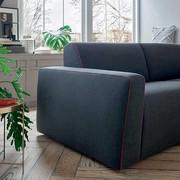 Precise, sartorial stitching which follows the lines of the cushions and armrests of the Icon sofa bed