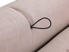 Detail of the lanyard for rotating the backrest: with the sofa bed closed, the lanyard is hidden in the gap between the two cushions