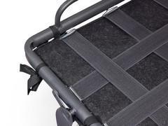 Detail of the elastic straps on the part of the bed base that goes over the seat when the sofa is closed