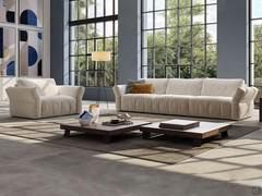 Modern living room with Cure sofa consisting of an end bed combined with a fixed end and an armchair that can be fixed or converted into a single bed.