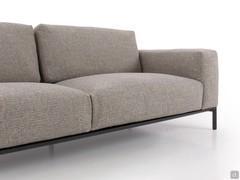 Detail of the dark grey metal base in die-cast aluminium outlining the lower profile of the Richmond sofa